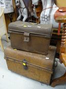 Two small vintage tin trunks