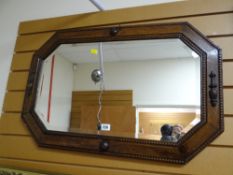 A vintage oak framed bead work mirror
