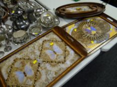 Three exotic butterfly winged trays together with an English Sheraton-style oval tray with plaque