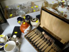 A box of glassware, four Oriental pottery items, cased cutlery & a vintage brass balance scales
