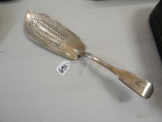 A Georgian silver hollow-work fish slice engraved 'W' to the terminal