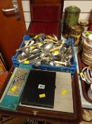 A large quantity of loose cutlery, cased cutlery items & an antique writing box (distressed)