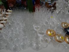 A large quantity of drinking glasses