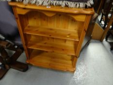 Small honey pine three shelf low bookcase