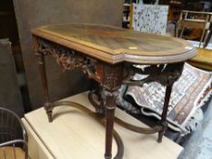 A small shaped top inlaid side table with carved frieze & stretcher base