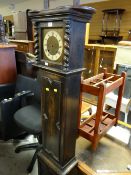 A vintage dark oak grandmother clock (distressed) together with a pair of wooden smoker's