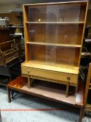 A vintage Turnidge of London small raised sliding glass bookcase with drawer to base together with a