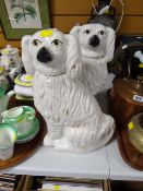 A pair of large seated nineteenth century Staffordshire dogs with painted eyes & snout