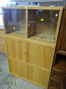 An IKEA Malm oak veneer display cabinet with glass doors to upper section & a cupboard base