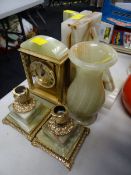 A suite of onyx ware including candlesticks & clock