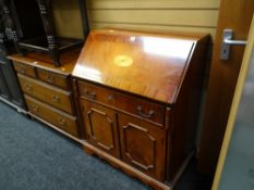 A reproduction sloped bureau