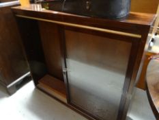 A vintage sliding glass door narrow bookcase