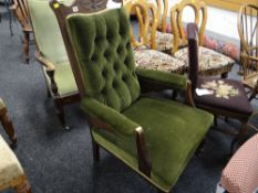 A button upholstered antique elbow chair