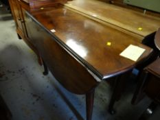 A polished oak antique circular gate-leg dining table