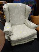 A reproduction Queen Anne-style wingback armchair (with later cover & cushion cover)