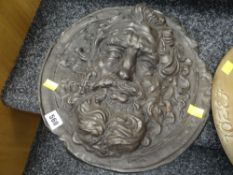 An interesting antique cast bronze roundel of a bearded man