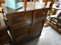 A dark oak Priory-style hi-fi cabinet