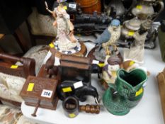 A pair of ebonized elephant bookends, a novelty wooden cigarette dispenser, two Leonardo