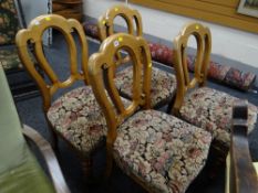 A set of four balloon back antique chairs with stuff-over upholstered seats