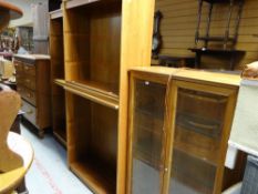 A modern lightwood glass door display cabinet together with a pair of matching mahogany effect