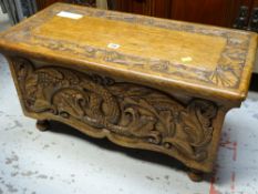 A good heavily carved oak blanket box