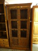 A modern Islamic-style carved decorated two-door cabinet with metal door pulls