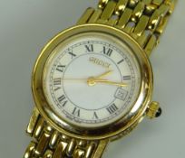 A MODERN YELLOW METAL 7300L SAPPHIRE CRYSTAL LADIES GUCCI WRISTWATCH with gate-link bracelet