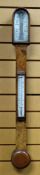 A NINETEENTH CENTURY WALNUT ENCASED STICK BAROMETER by T B Winter of Grey Street, Newcastle-on-