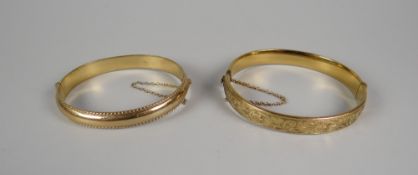 A 9CT YELLOW GOLD BANGLE, 12.4gms and another with metal core
