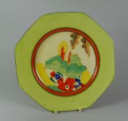A CLARICE CLIFF 'BIZARRE' TEA PLATE of octagonal form with a garden scene, 22cms diam