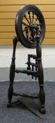 A MAINLY NINETEENTH CENTURY OAK UPRIGHT SPINNING WHEEL