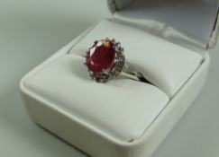 A 14k WHITE GOLD PINK SAPPHIRE & DIAMOND RING with accompanying certificate from Atlantis