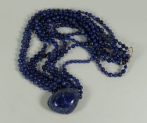 AN EIGHT STRAND LAPIS LAZULI BEAD NECKLACE & PENDANT, 45cms long Provenance: Estate of Helen