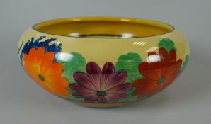 A CLARICE CLIFF SHALLOW FRUIT BOWL IN THE 'GAY DAY' PATTERN decorated with flowers, 20cms diam
