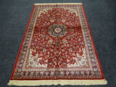 KASHMIR RUG red ground medallion design, 156 x 236cms