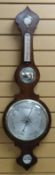 A NINETEENTH CENTURY ROSEWOOD WHEEL BAROMETER having three silvered dials, circular convex mirror,