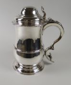 A RARE GEORGE III SILVER TANKARD by William Grundy, 1766 of baluster form on spreading circular