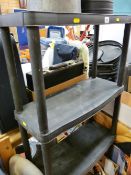 Four sets of black plastic storage shelves