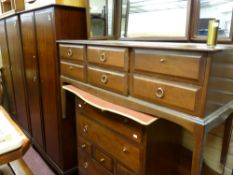 Stag mahogany bedroom suite to include a pair of two door wardrobes, triple mirrored dressing