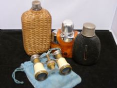 Three drinking flasks and a pair of opera glasses