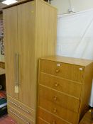 Ultra-modern two door light wood wardrobe with lower drawers and a vintage six drawer chest