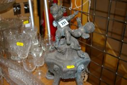 Heavy metallic centrepiece topped with cherubs