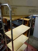 Chrome and wooden four shelf stand and a bathroom organizer