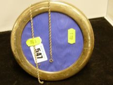 Silver circular portrait frame and a white metal necklace