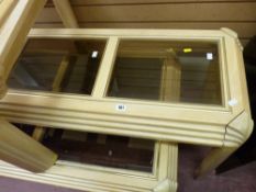 Suite of four light wood glass topped coffee and side tables