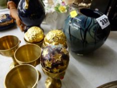 Bulbous glass vase, six brass eggcups with enamel decoration etc