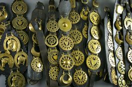 FOURTEEN SHIRE/HEAVY HORSE LEATHER MARTINGALES holding a good selection of antique and later pierced