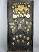 SHIRE/HEAVY HORSE BRASSWARE - a 4ft display board mounted with three leather display pads,