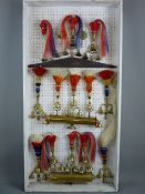 SHIRE/HEAVY HORSE BRASSWARE - a 4ft display board of multi-bell fly head terrets with tricolour