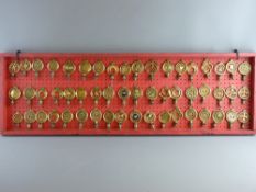 SHIRE/HEAVY HORSE BRASSWARE - a 4ft display board showing fifty four brass terrets/swingers